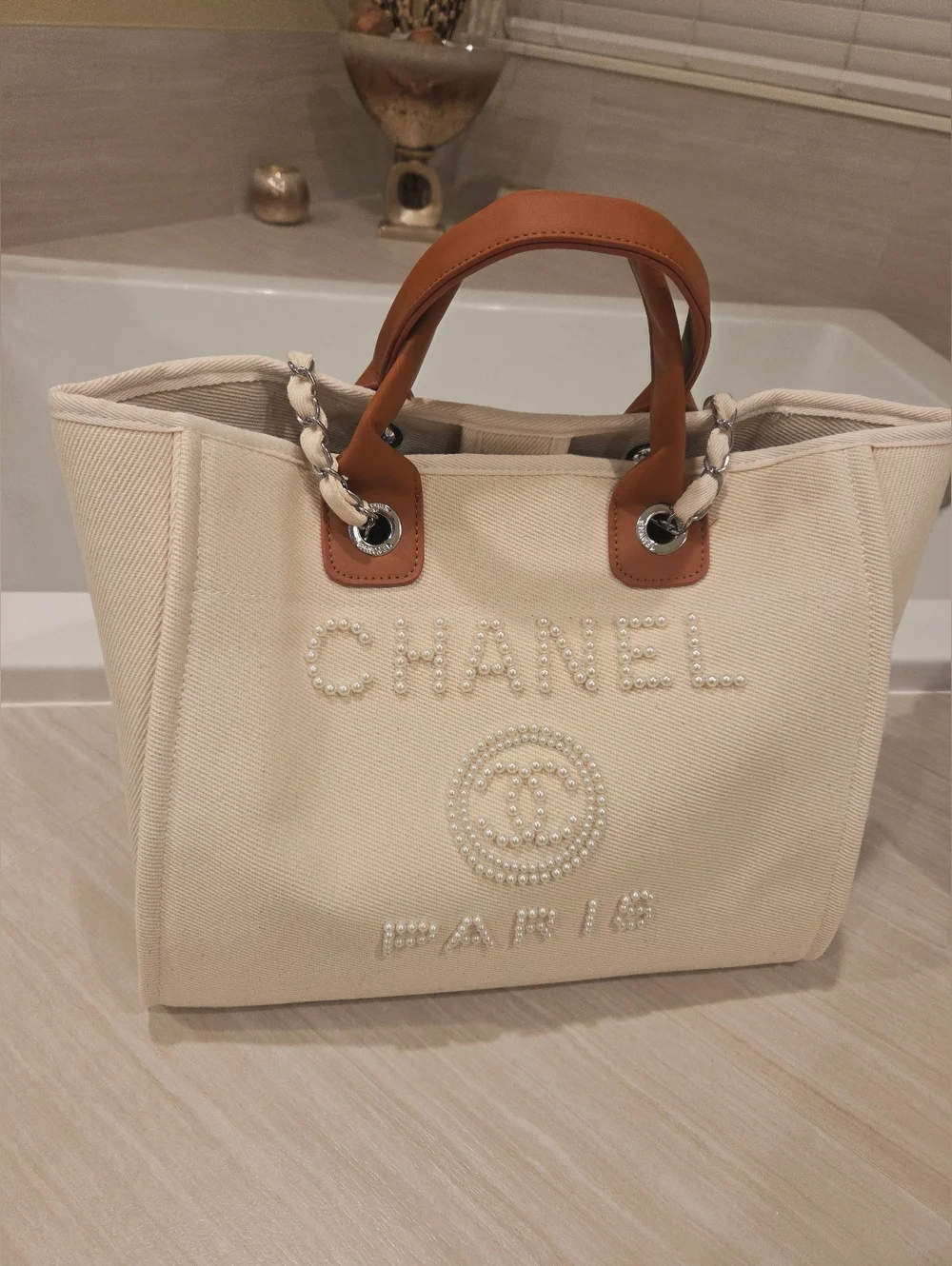 CHANEL Cream Canvas Tote with Pearl Logo and Tan Leather Handles - Picture 1 of 5